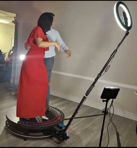 Guests standing on the 360 photo booth platform