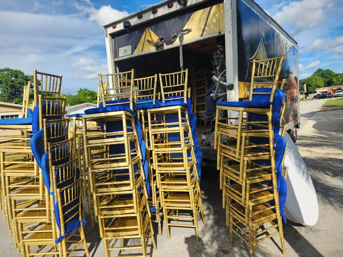 Chiavari chairs stacked and loaded onto the delivery truck